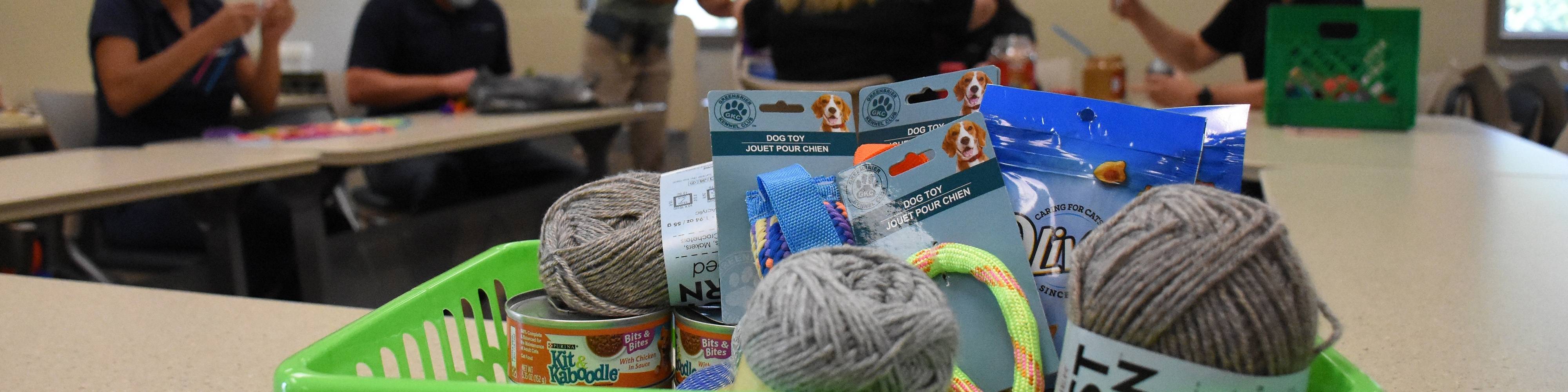 Volunteers make treats and toys for ACAC animals.