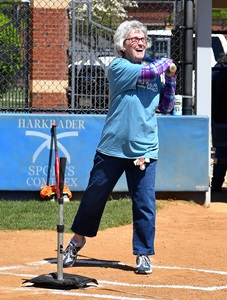Participants in Softball Hit and Throw event swings bat.