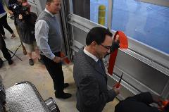 County Administrator, Craig Meadows, helps cut the ribbon at the Riner Fire Station Ribbon Cutting Ceremony