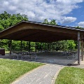 The picnic shelter at Eastern Montgomery Park is lined by trees and green space.