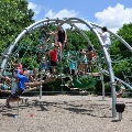 Kids enjoy playing on the jungle gym at Mid County Park playground.